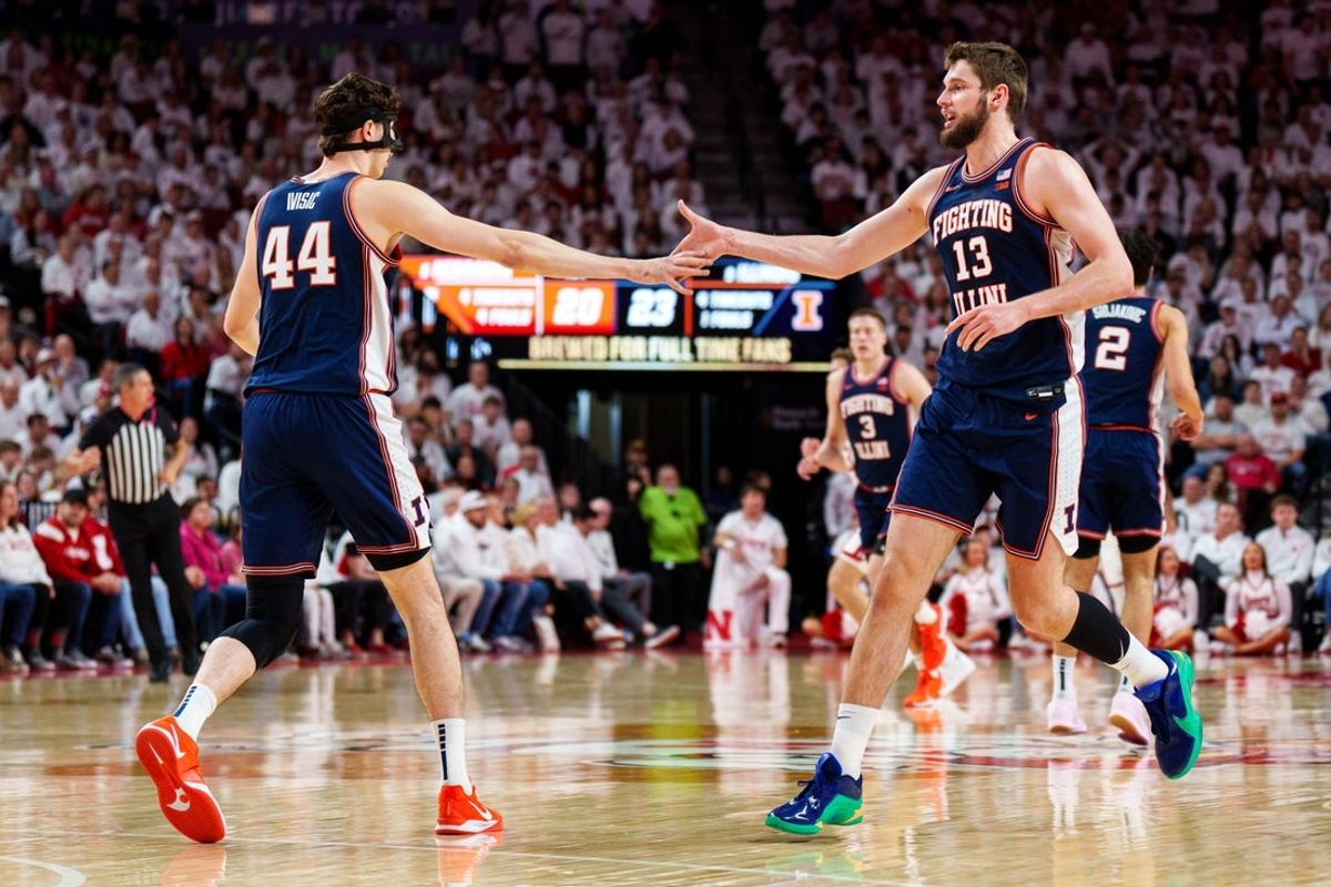 Feb 1, 2026; Lincoln, Nebraska, USA; Illinois Fighting Illini center Tomislav Ivisic (13) and center Zvonimir Ivisic (44) celebrate after a shot in the first half against the Nebraska Cornhuskers at Pinnacle Bank Arena. Mandatory Credit: Dylan Widger-Imagn Images