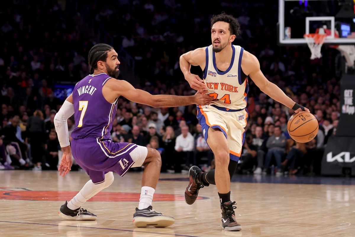 Feb 1, 2026; New York, New York, USA; New York Knicks guard Landry Shamet (44) controls the ball against Los Angeles Lakers guard Gabe Vincent (7) during the second quarter at Madison Square Garden. Mandatory Credit: Brad Penner-Imagn Images