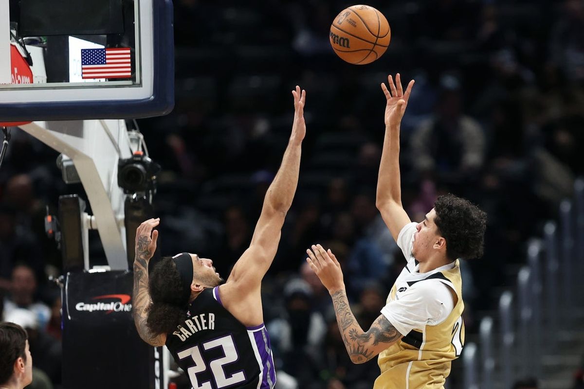 Feb 1, 2026; Washington, District of Columbia, USA; Washington Wizards guard Will Riley (27) takes a shot over Sacramento Kings guard Devin Carter (22) during the second half at Capital One Arena. Mandatory Credit: Daniel Kucin Jr.-Imagn Images