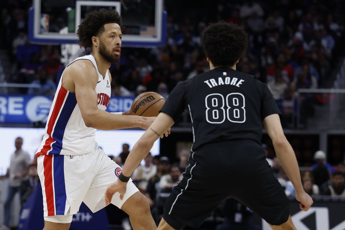Feb 1, 2026; Detroit, Michigan, USA;  Detroit Pistons guard Cade Cunningham (2) dribbles defended by Brooklyn Nets guard Nolan Traore (88) in the second half at Little Caesars Arena. Mandatory Credit: Rick Osentoski-Imagn Images