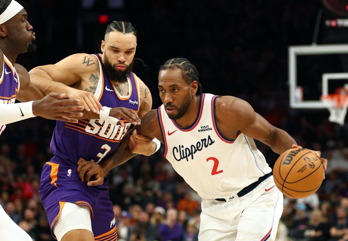 Feb 1, 2026; Phoenix, Arizona, USA; Los Angeles Clippers forward Kawhi Leonard (2) against Phoenix Suns forward Dillon Brooks (3) in the first half at Mortgage Matchup Center. Mandatory Credit: Mark J. Rebilas-Imagn Images