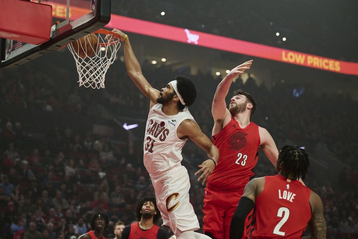 Feb 1, 2026; Portland, Oregon, USA; Cleveland Cavaliers center Jarrett Allen (31) dunks the basketball during the first half against Portland Trail Blazers center Donovan Clingan (23) at Moda Center. Mandatory Credit: Troy Wayrynen-Imagn Images