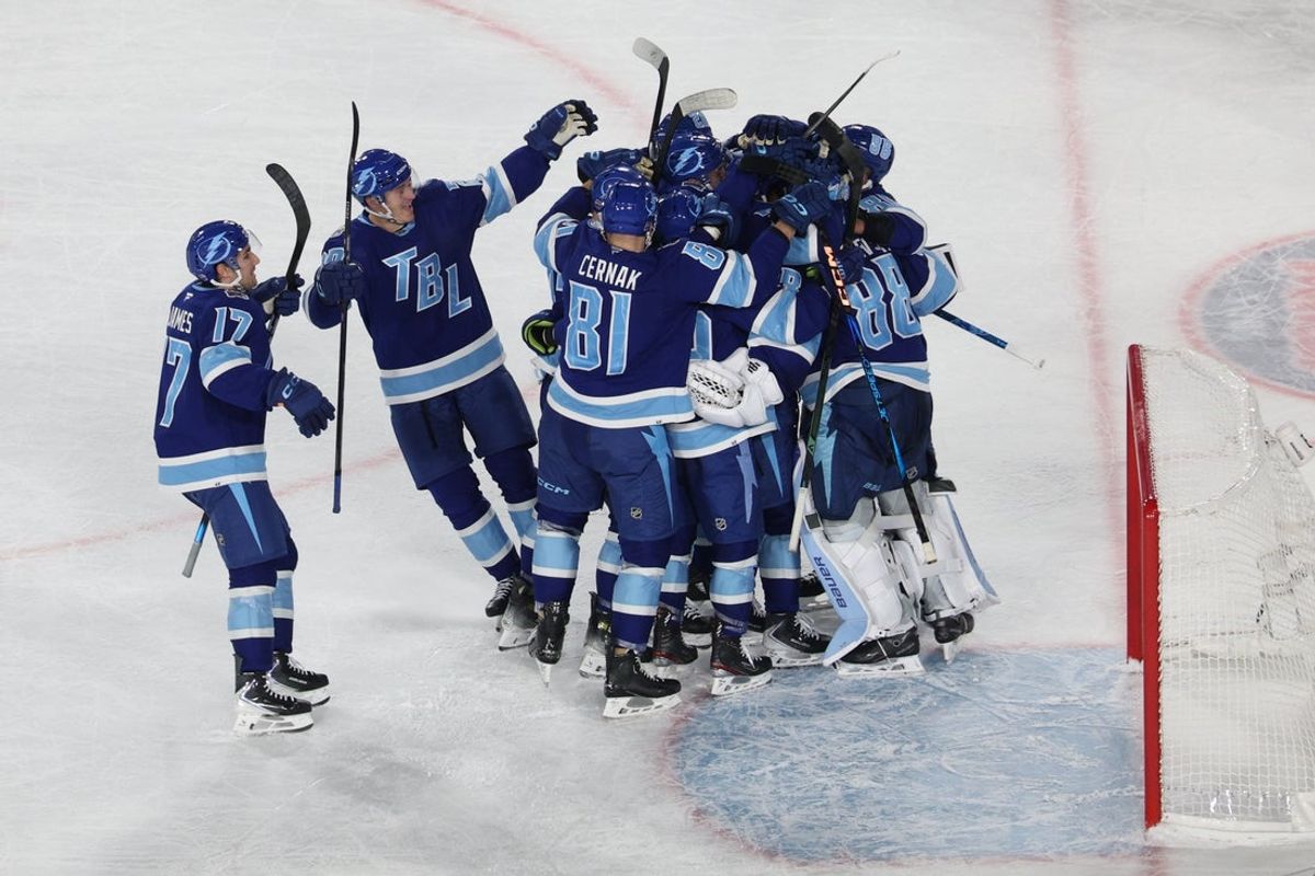 Feb 1, 2026; Tampa Bay, Florida, USA; The Tampa Bay Lightning celebrate their shootout victory in the 2026 Stadium Series ice hockey game against the Boston Bruins at Raymond James Stadium. Mandatory Credit: Nathan Ray Seebeck-Imagn Images