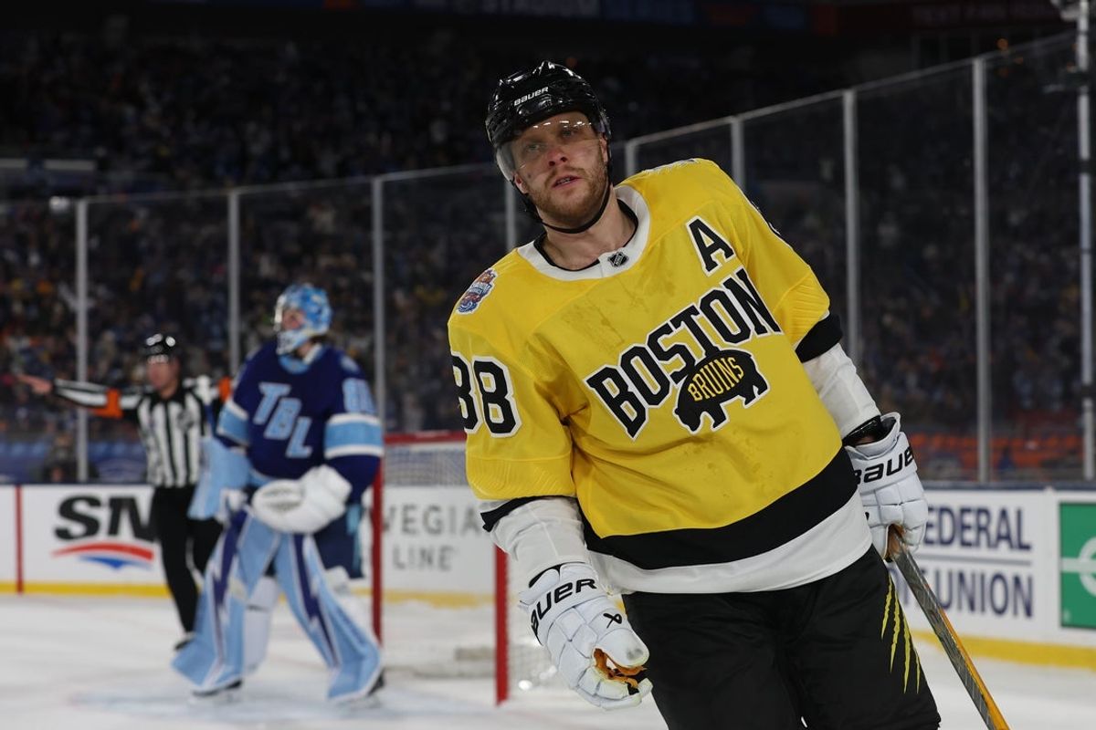 Feb 1, 2026; Tampa Bay, Florida, USA; Boston Bruins right wing David Pastrnak (88) reacts after missing during a shootout in the 2026 Stadium Series ice hockey game against the Tampa Bay Lightning at Raymond James Stadium. Mandatory Credit: Kim Klement Neitzel-Imagn Images