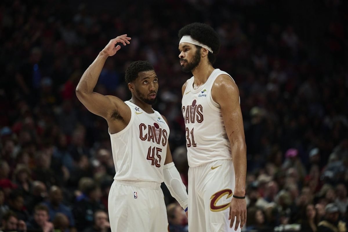 Feb 1, 2026; Portland, Oregon, USA; Cleveland Cavaliers guard Donovan Mitchell (45) talks to center Jarrett Allen (31) during the second half against the Portland Trail Blazers  at Moda Center. Mandatory Credit: Troy Wayrynen-Imagn Images