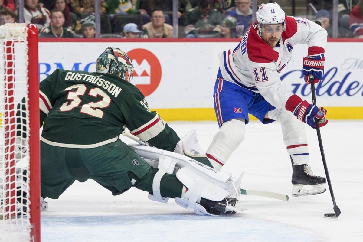 Feb 2, 2026; Saint Paul, Minnesota, USA; Montreal Canadiens right wing Brendan Gallagher (11) scores on Minnesota Wild goaltender Filip Gustavsson (32) in the first period at Grand Casino Arena. Mandatory Credit: Matt Blewett-Imagn Images