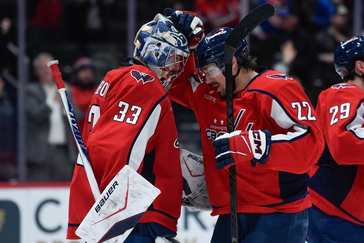 Feb 2, 2026; Washington, District of Columbia, USA; Washington Capitals goaltender Clay Stevenson (33) and right wing Brandon Duhaime (22) celebrate after the game against the New York Islanders at Capital One Arena. Mandatory Credit: Hannah Foslien-Imagn Images