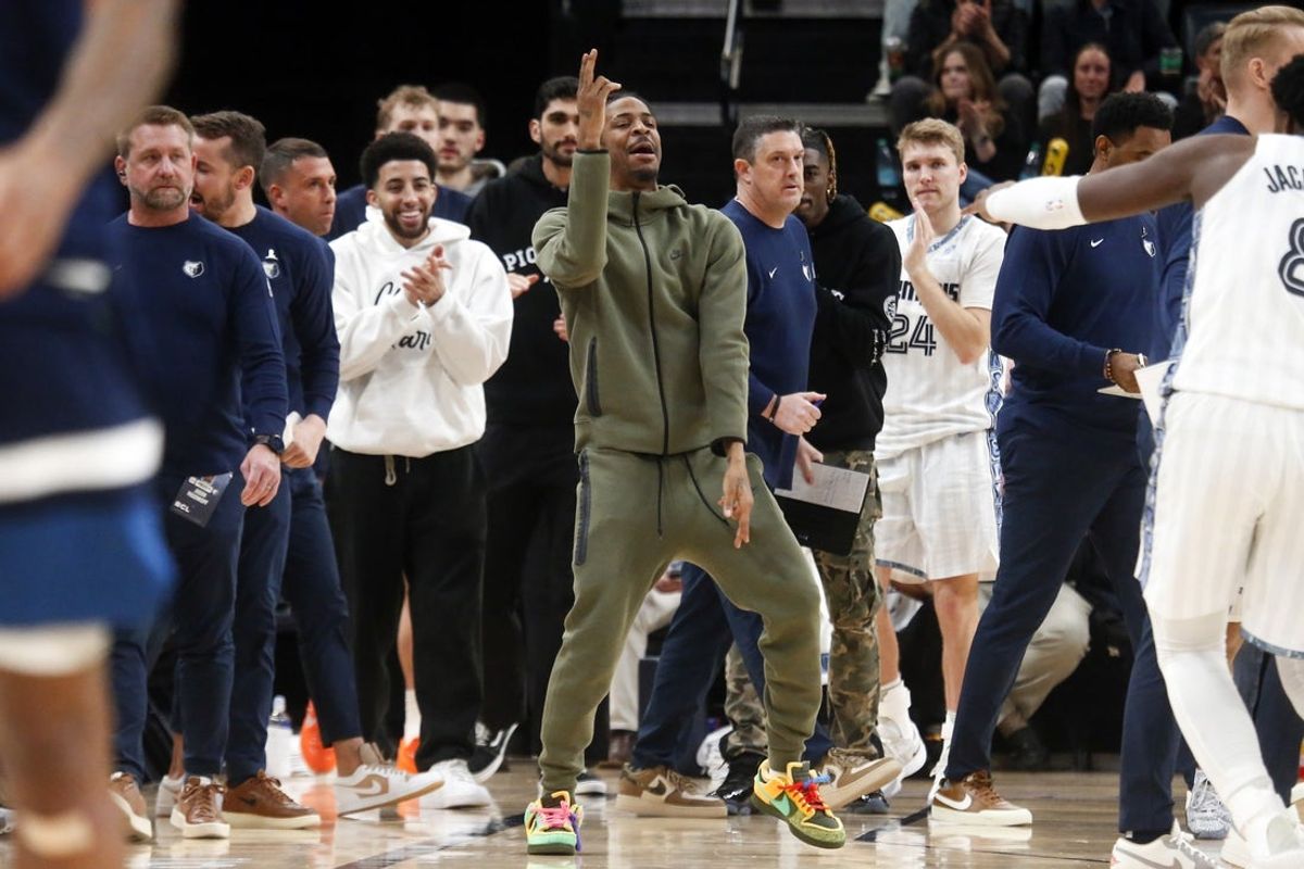 Feb 2, 2026; Memphis, Tennessee, USA; Memphis Grizzlies guard Ja Morant (12) reacts with forward/center Jaren Jackson Jr. (8) after a basket during the fourth quarter against the Minnesota Timberwolves at FedExForum. Mandatory Credit: Petre Thomas-Imagn Images