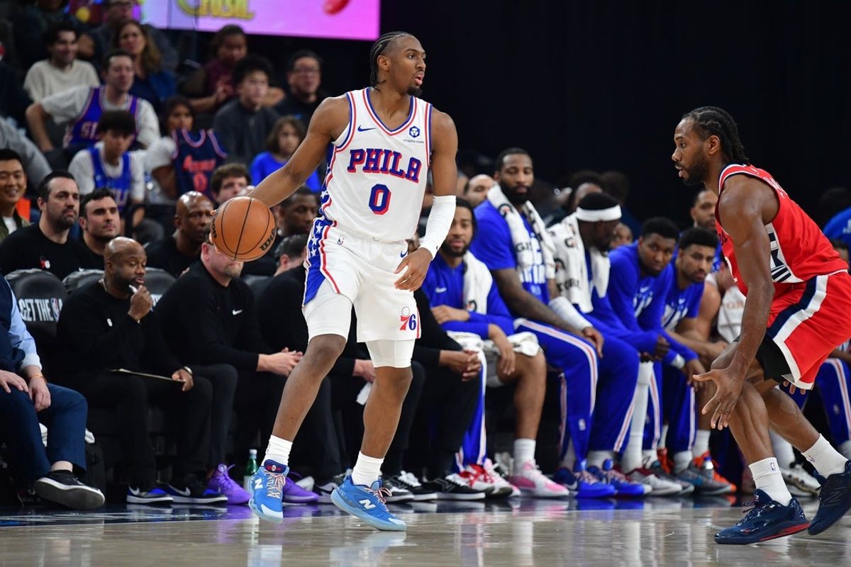 Feb 2, 2026; Inglewood, California, USA; Philadelphia 76ers guard Tyrese Maxey (0) controls the ball against Los Angeles Clippers forward Kawhi Leonard (2) during the first half at Intuit Dome. Mandatory Credit: Gary A. Vasquez-Imagn Images