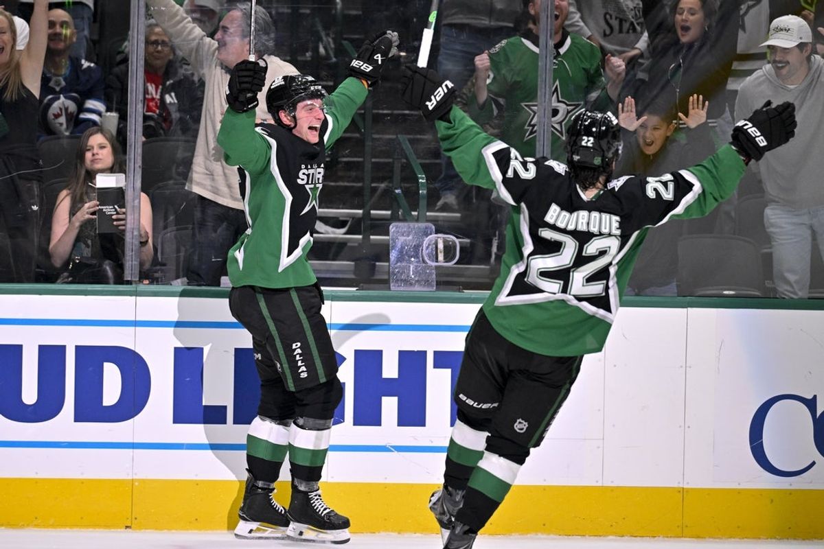 Feb 2, 2026; Dallas, Texas, USA; Dallas Stars defenseman Thomas Harley (55) and center Mavrik Bourque (22) celebrate after Harley scores the game winning goal the Winnipeg Jets during the overtime period at the American Airlines Center. Mandatory Credit: Jerome Miron-Imagn Images