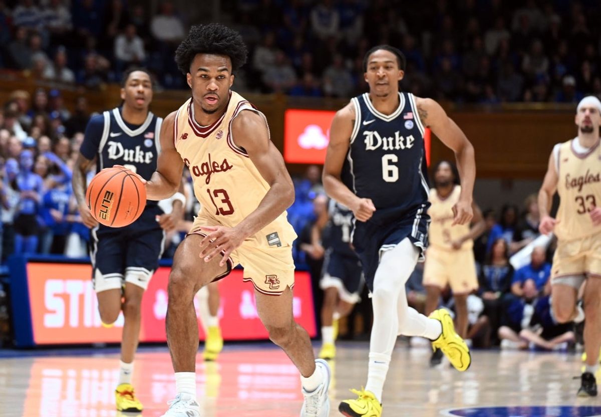 Feb 3, 2026; Durham, North Carolina, USA;  Boston College Eagles guard Donald Hand Jr. (13) drives to the basket as Duke Blue Devils forward Maliq Brown (6) pursues during the first half at Cameron Indoor Stadium. Mandatory Credit: Rob Kinnan-Imagn Images