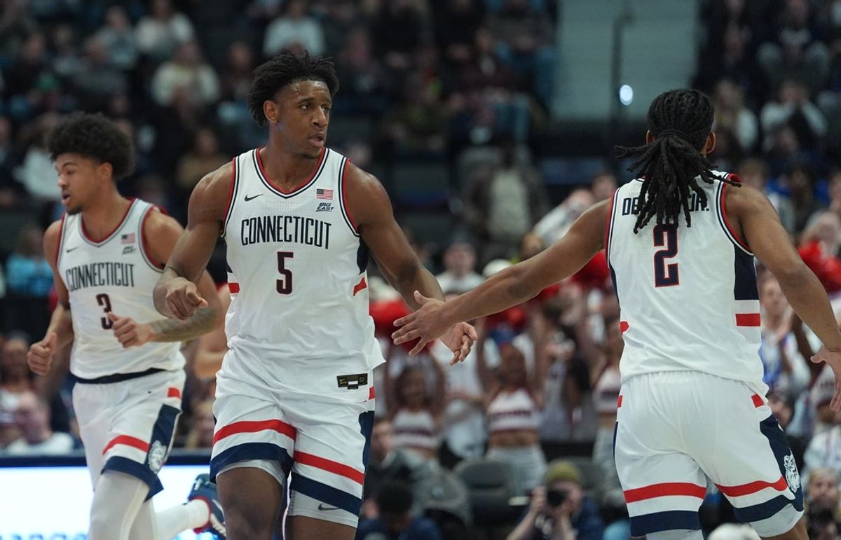 Feb 3, 2026; Hartford, Connecticut, USA; UConn Huskies forward Tarris Reed Jr. (5) reacts with guard Silas Demary Jr. (2) as they take on the Xavier Musketeers in the first half at PeoplesBank Arena. Mandatory Credit: David Butler II-Imagn Images