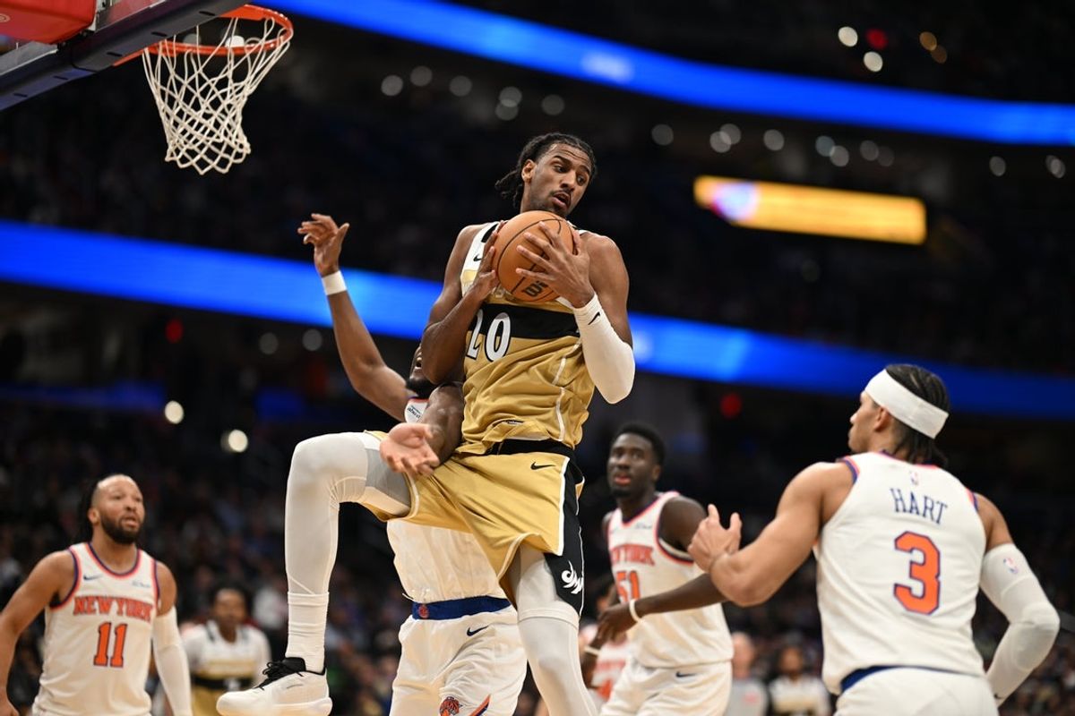 Feb 3, 2026; Washington, District of Columbia, USA; Washington Wizards center Alex Sarr (20) grabs a rebound in front of New York Knicks guard Josh Hart (3) during the first quarter at Capital One Arena. Mandatory Credit: Rafael Suanes-Imagn Images