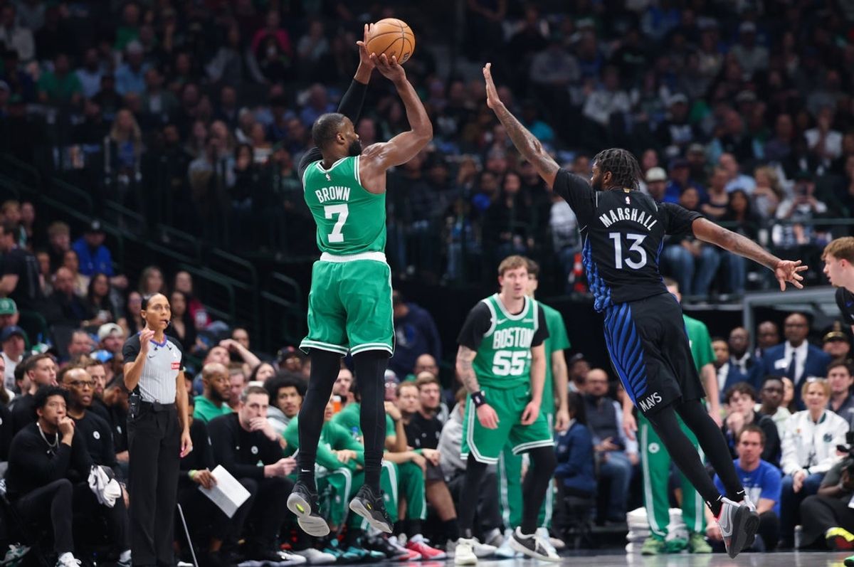 Feb 3, 2026; Dallas, Texas, USA;  Boston Celtics guard Jaylen Brown (7) shoots over Dallas Mavericks forward Naji Marshall (13) during the first quarter at American Airlines Center. Mandatory Credit: Kevin Jairaj-Imagn Images
