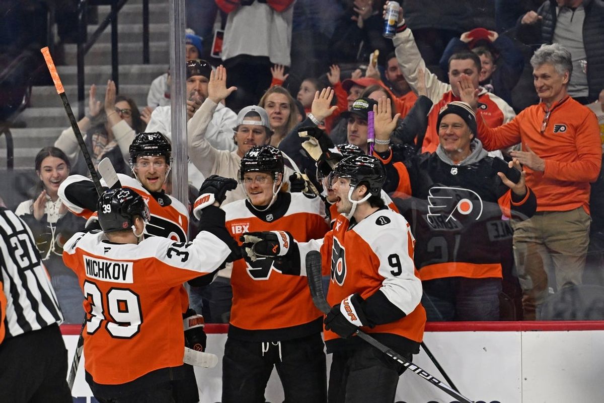 Feb 3, 2026; Philadelphia, Pennsylvania, USA; Philadelphia Flyers right wing Owen Tippett (74) celebrates his goal with teammates against the Washington Capitals during the first period at Xfinity Mobile Arena. Mandatory Credit: Eric Hartline-Imagn Images