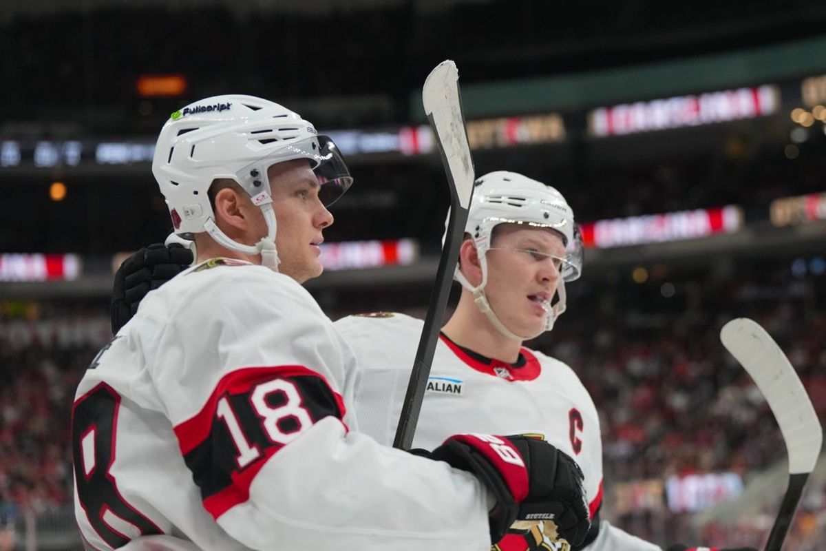 Feb 3, 2026; Raleigh, North Carolina, USA;  Ottawa Senators center Tim Stützle (18) celebrates his goal with  left wing Brady Tkachuk (7) against the Carolina Hurricanes during the second period at Lenovo Center. Mandatory Credit: James Guillory-Imagn Images