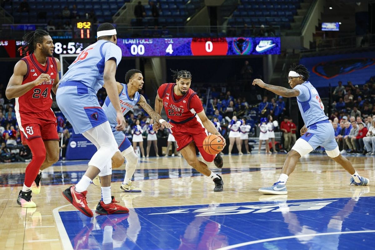 Feb 3, 2026; Chicago, Illinois, USA: St. John's Red Storm forward Bryce Hopkins (23) drives to the basket against the DePaul Blue Demons during the first half at Wintrust Arena. Mandatory Credit: Kamil Krzaczynski-Imagn Images