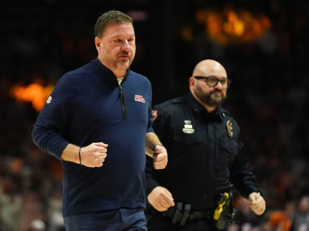 Ole Miss basketball coach Chris Beard is escorted off the after being ejected for getting two technical fouls during an NCAA college basketball game against Tennessee on February 3, 2026, in Knoxville, Tennessee.