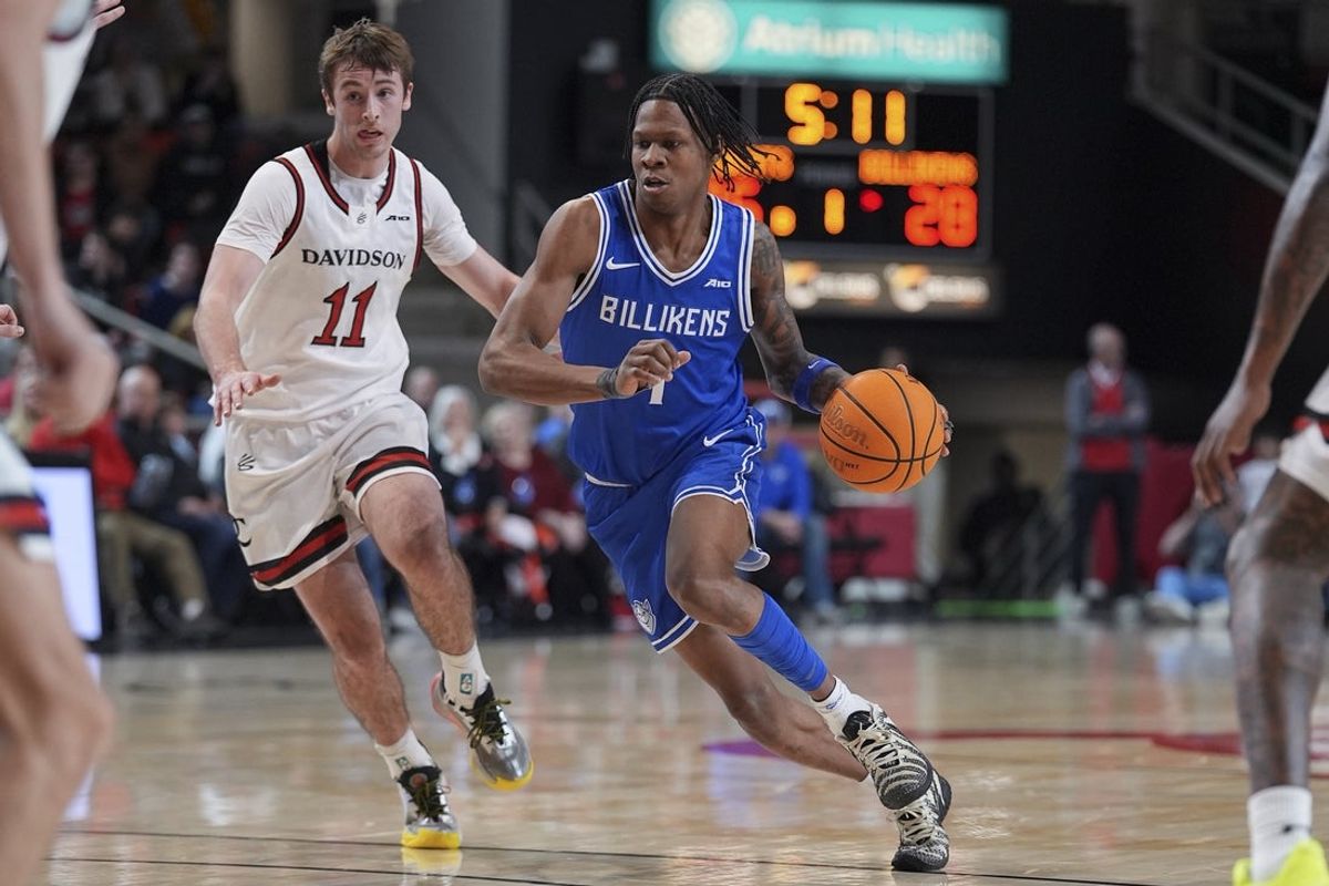 Feb 3, 2026; Davidson, North Carolina, USA; Saint Louis Billikens guard Quentin Jones (1) handles the ball defended by Davidson Wildcats guard Sam Brown (11) during the first half at McKillop Court at John M. Belk Arena. Mandatory Credit: Jim Dedmon-Imagn Images