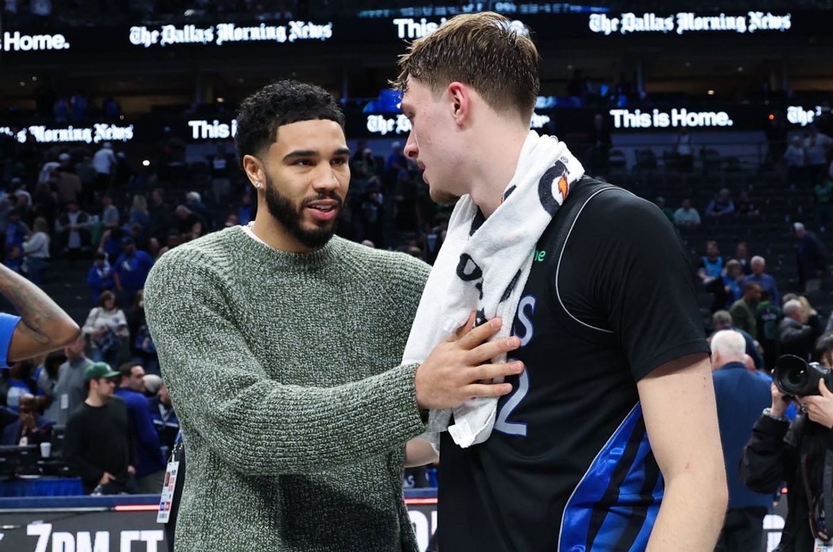 Feb 3, 2026; Dallas, Texas, USA; Dallas Mavericks forward Cooper Flagg (32) hugs Boston Celtics forward Jayson Tatum  after the game at American Airlines Center. Mandatory Credit: Kevin Jairaj-Imagn Images