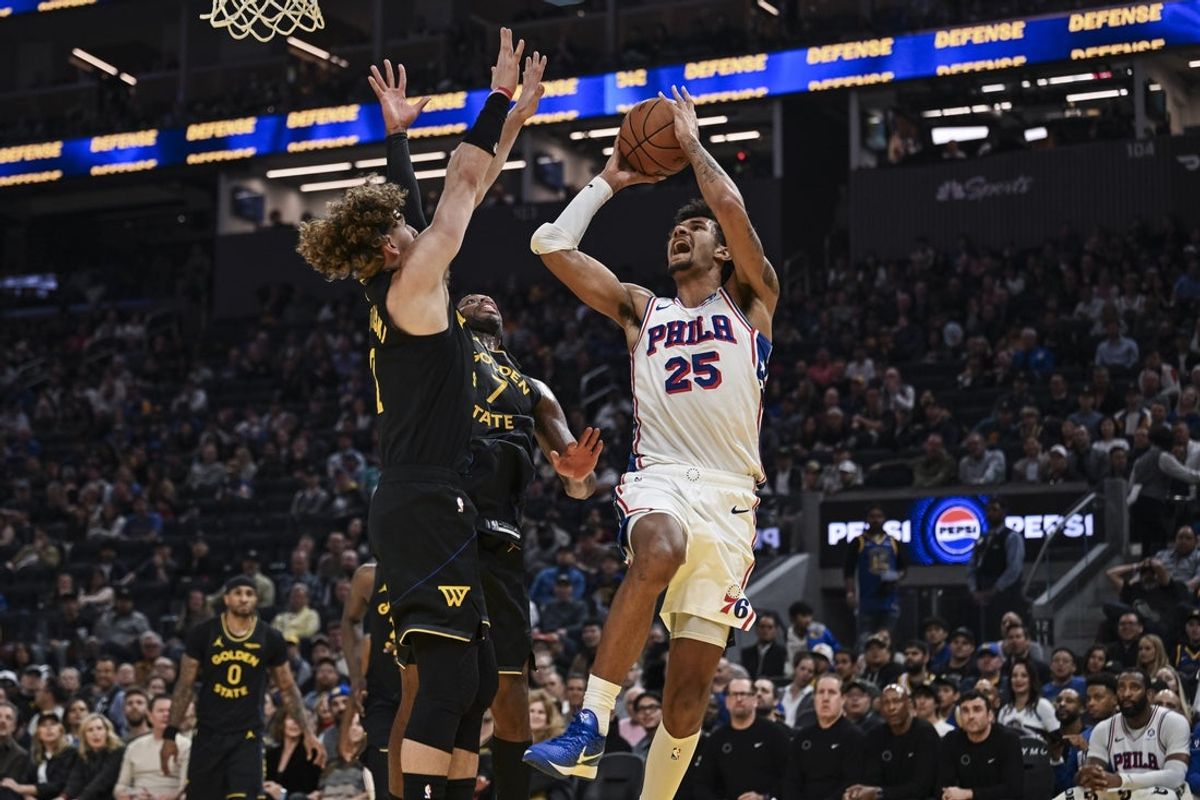 Feb 3, 2026; San Francisco, California, USA; Philadelphia 76ers forward Dominick Barlow (25) shoots over Golden State Warriors guard Brandin Podziemski (2) during the second period at Chase Center. Mandatory Credit: Justine Willard-Imagn Images