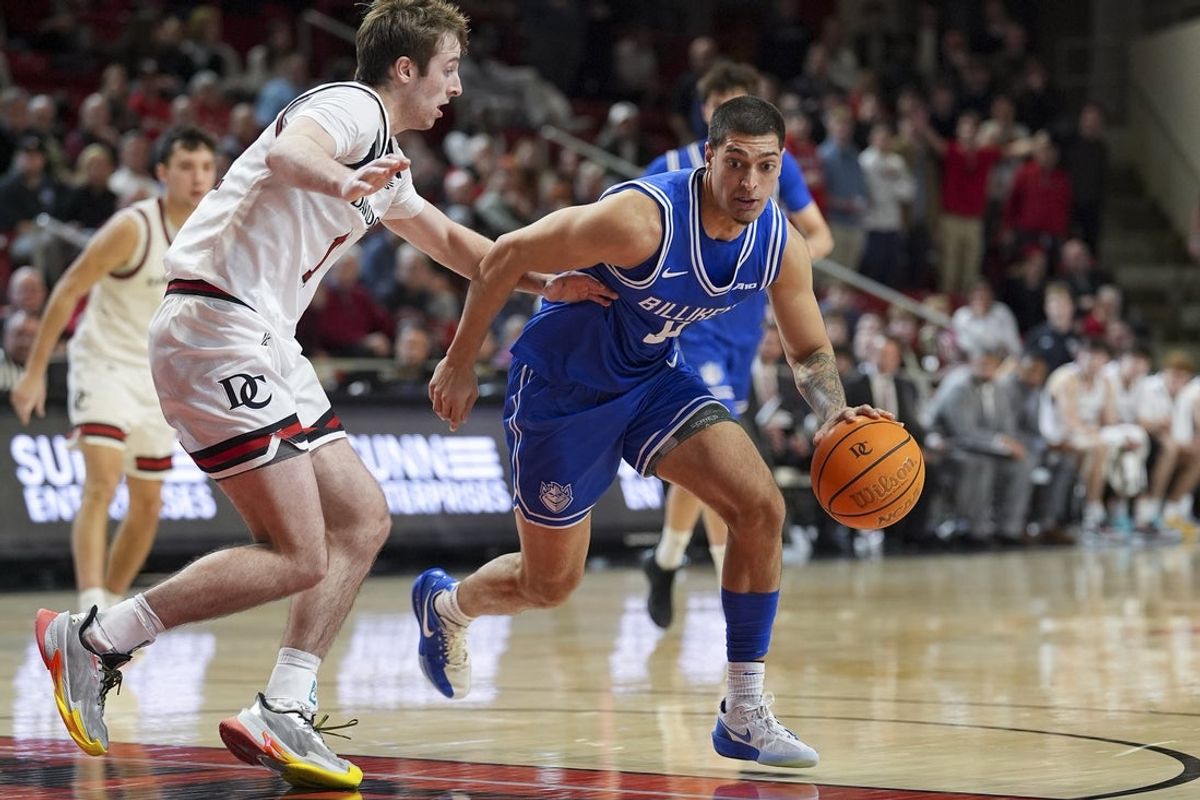Feb 3, 2026; Davidson, North Carolina, USA; Saint Louis Billikens forward Ishan Sharma (9) handles the ball defended by Davidson Wildcats guard Parker Friedrichsen (5) during the second half at McKillop Court at John M. Belk Arena. Mandatory Credit: Jim Dedmon-Imagn Images