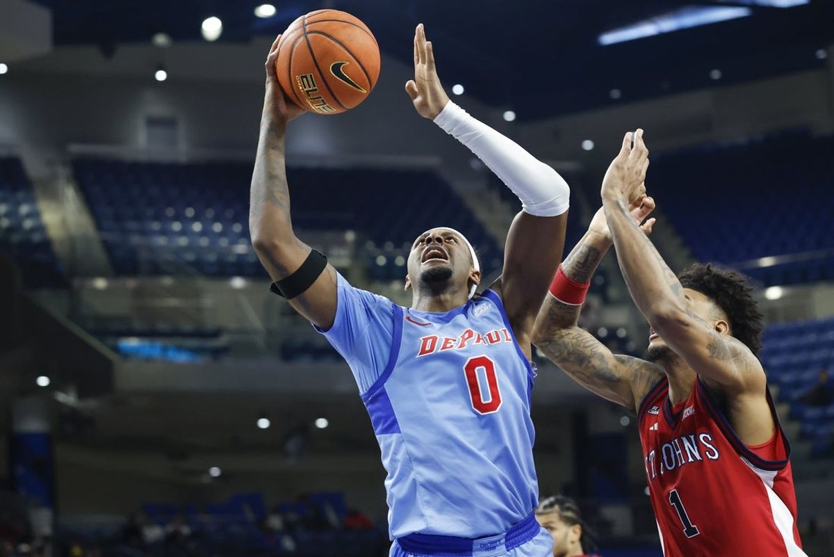 Feb 3, 2026; Chicago, Illinois, USA; DePaul Blue Demons guard Brandon MacLin (0) goes to the basket against St. John's Red Storm forward Dillon Mitchell (1) during the second half at Wintrust Arena. Mandatory Credit: Kamil Krzaczynski-Imagn Images
