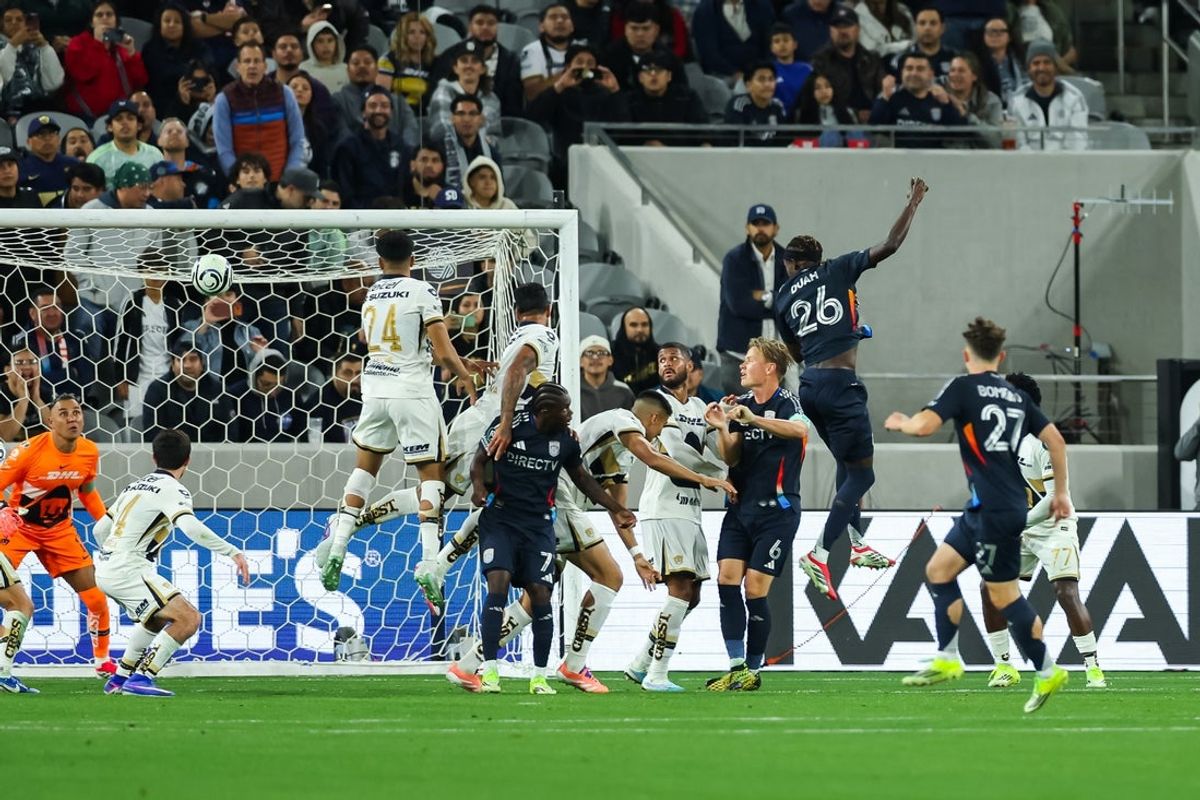 Feb 3, 2026; San Diego, California, USA; San Diego FC midfielder Manu Duah (26) scores on a header during the second half against Pumas UNAM at Snapdragon Stadium. Mandatory Credit: Chadd Cady-Imagn Images