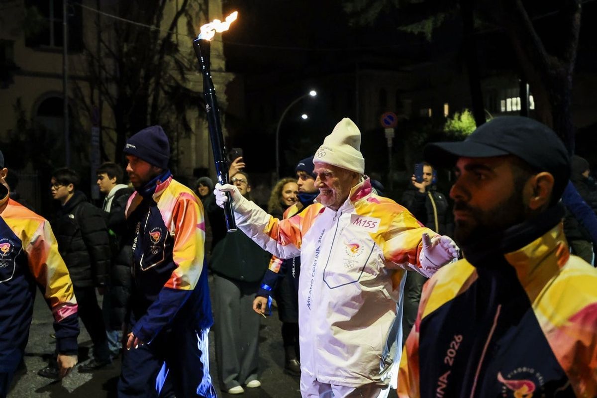 Feb 3, 2026; Como, ITALY; The Olympic torch arrives in Como during the Milano Cortina 2026 Olympic Winter Games. Mandatory Credit: Katie Stratman-Imagn Images