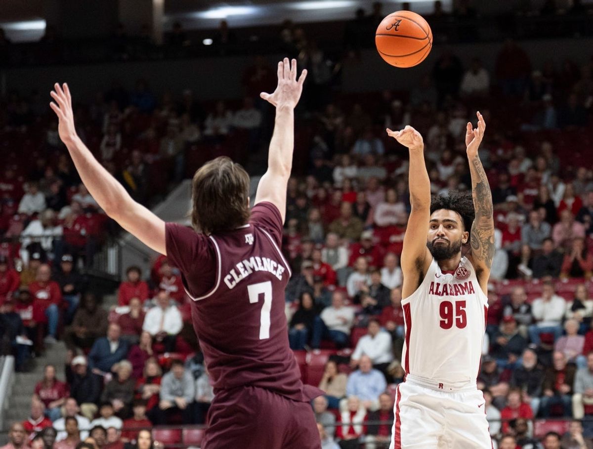 Feb 4, 2026; Tuscaloosa, AL, USA; Alabama guard Houston Mallette (95) shoots a three pointer over Texas A&M forward Zach Clemence (7) at Coleman Coliseum. Mandatory Credit: Gary Cosby Jr.-Tuscaloosa News