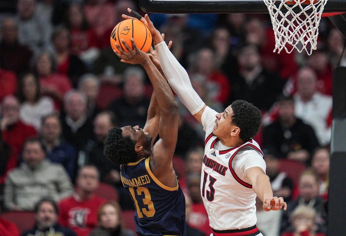 Louisville Cardinals forward Sananda Fru (13) blocks the shot of Notre Dame Fighting Irish guard Sir Mohammed (13) in the first half at the KFC Yum! Center Wednesday night Feb. 4, 2026