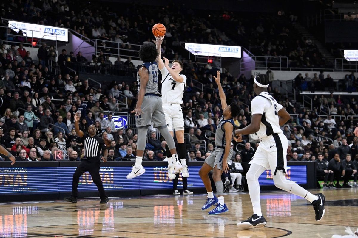 Feb 4, 2026; Providence, Rhode Island, USA; Providence Friars guard Stefan Vaaks (7) shoots over Butler Bulldogs center Drayton Jones (13) at the buzzer during the first half at Amica Mutual Pavilion. Mandatory Credit: Eric Canha-Imagn Images