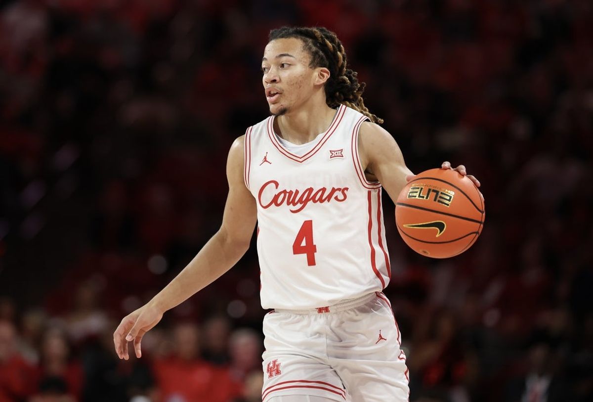 Feb 4, 2026; Houston, Texas, USA;  Houston Cougars guard Kingston Flemings (4) dribbles against the UCF Knights in the first half at Fertitta Center. Mandatory Credit: Thomas Shea-Imagn Images