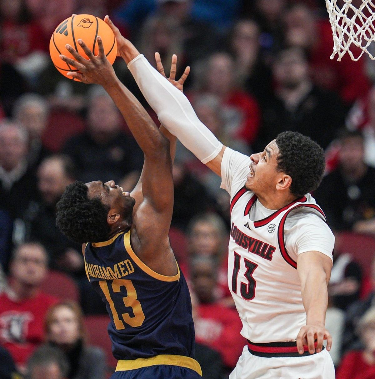 Louisville Cardinals forward Sananda Fru (13) blocks the shot of Notre Dame Fighting Irish guard Sir Mohammed (13) in the first half at the KFC Yum! Center Wednesday night Feb. 4, 2026