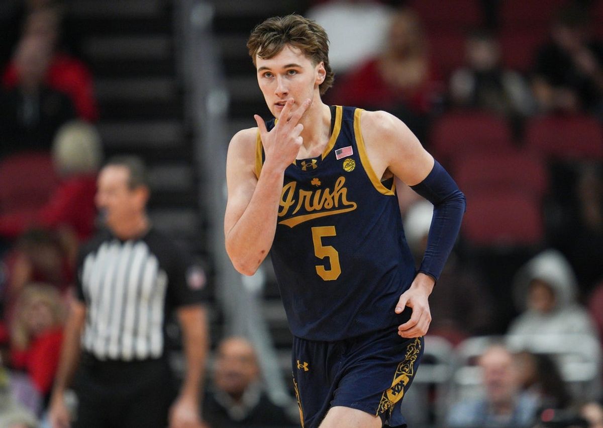 Notre Dame Fighting Irish guard Cole Certa (5) celebrates his three-point shot against Louisville in the first half at the KFC Yum! Center Wednesday night Feb. 4, 2026