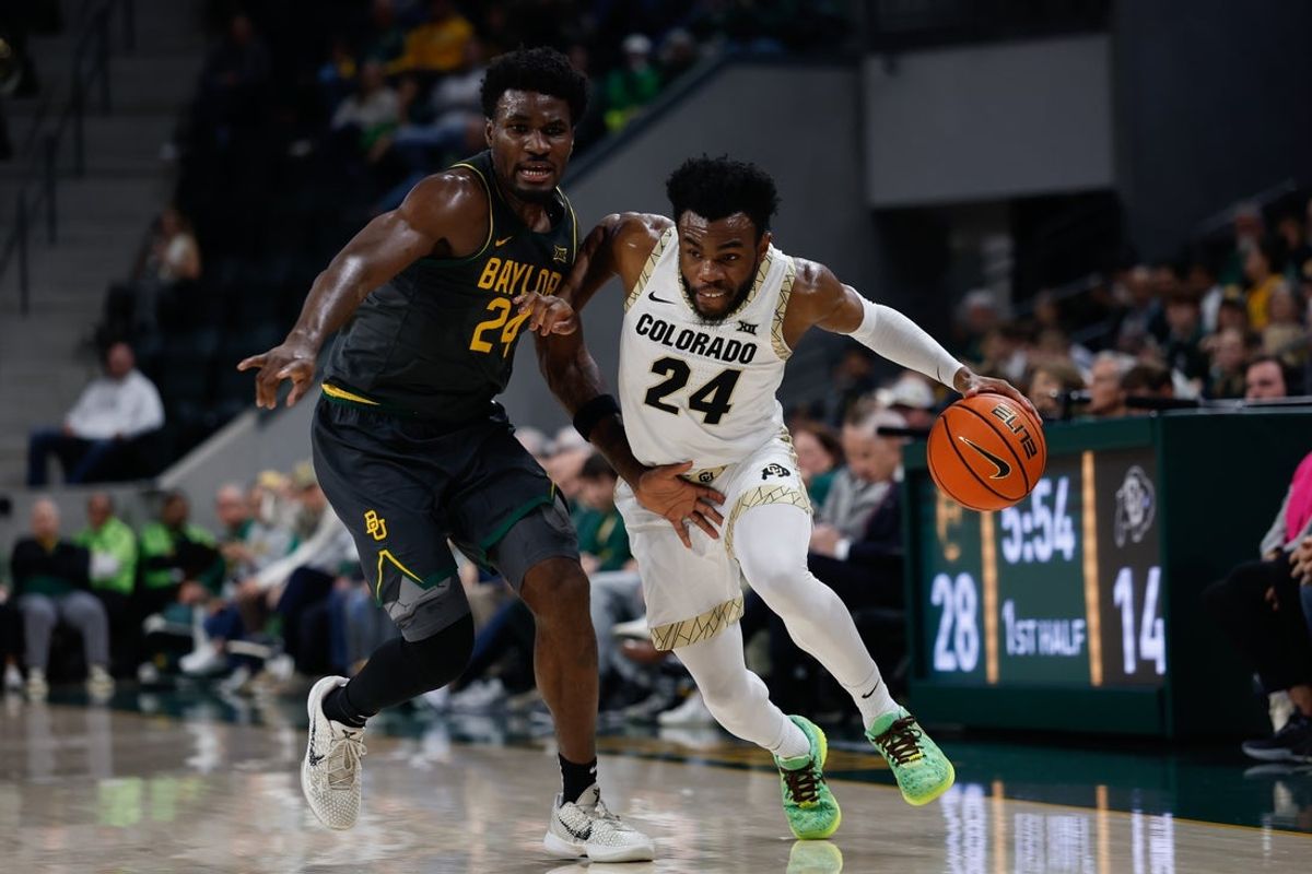 Feb 4, 2026; Waco, Texas, USA; Colorado Buffaloes guard Barrington Hargress (24) drives against Baylor Bears guard Tounde Yessoufou (24) during the first half at Paul and Alejandra Foster Pavilion. Mandatory Credit: Chris Jones-Imagn Images