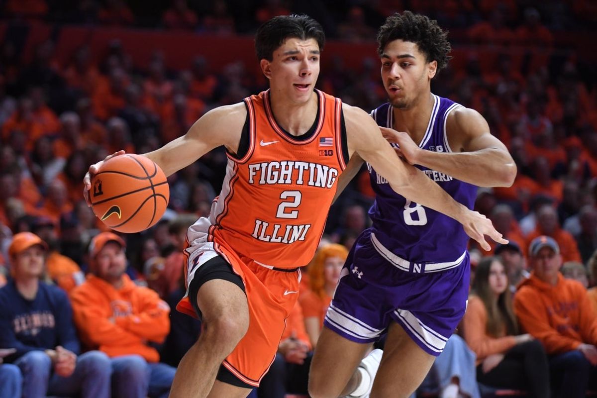 Feb 4, 2026; Champaign, Illinois, USA;  Illinois Fighting Illini guard Andrej Stojakovic (2) drives past Northwestern Wildcats forward Tre Singleton (8) during the first half at State Farm Center. Mandatory Credit: Ron Johnson-Imagn Images
