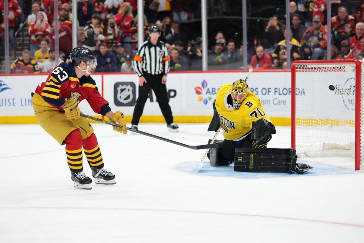 Feb 4, 2026; Sunrise, Florida, USA; Florida Panthers left wing Brad Marchand (63) scores the winning goal against Boston Bruins goaltender Joonas Korpisalo (70) during a shootout at Amerant Bank Arena. Mandatory Credit: Sam Navarro-Imagn Images