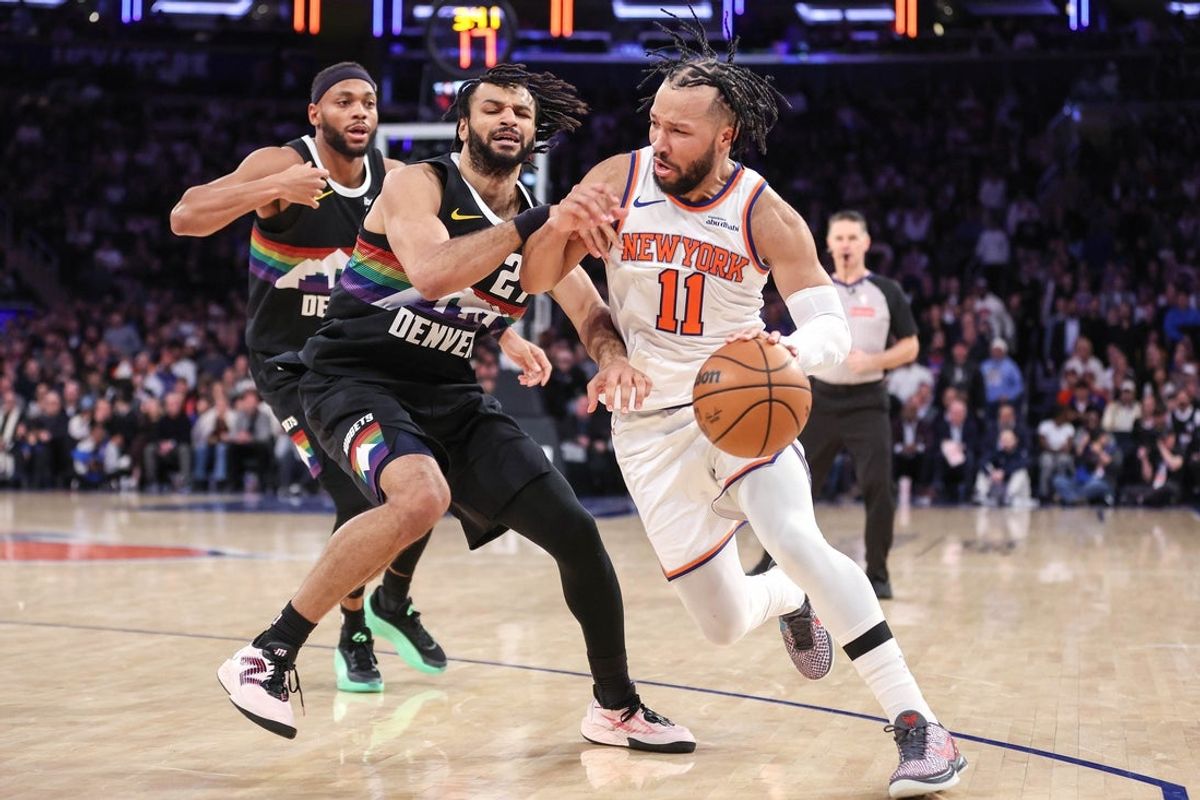 Feb 4, 2026; New York, New York, USA;  New York Knicks guard Jalen Brunson (11) looks to drive past Denver Nuggets guard Jamal Murray (27) in the second overtime at Madison Square Garden. Mandatory Credit: Wendell Cruz-Imagn Images