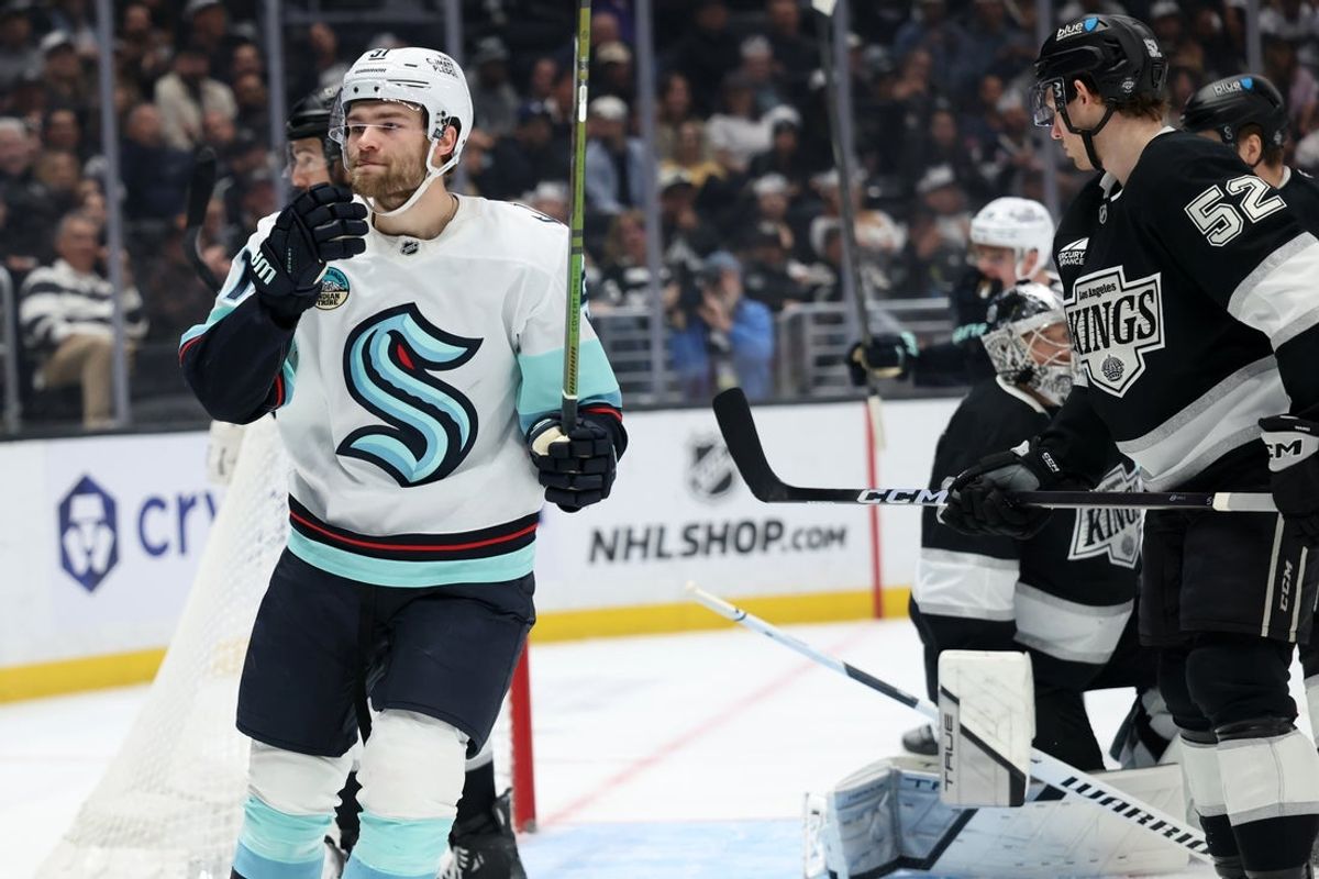 Feb 4, 2026; Los Angeles, California, USA;  Seattle Kraken center Shane Wright (51) reacts after scoring a goal against Los Angeles Kings goaltender Darcy Kuemper (35) during the first period at Crypto.com Arena. Mandatory Credit: Kiyoshi Mio-Imagn Images
