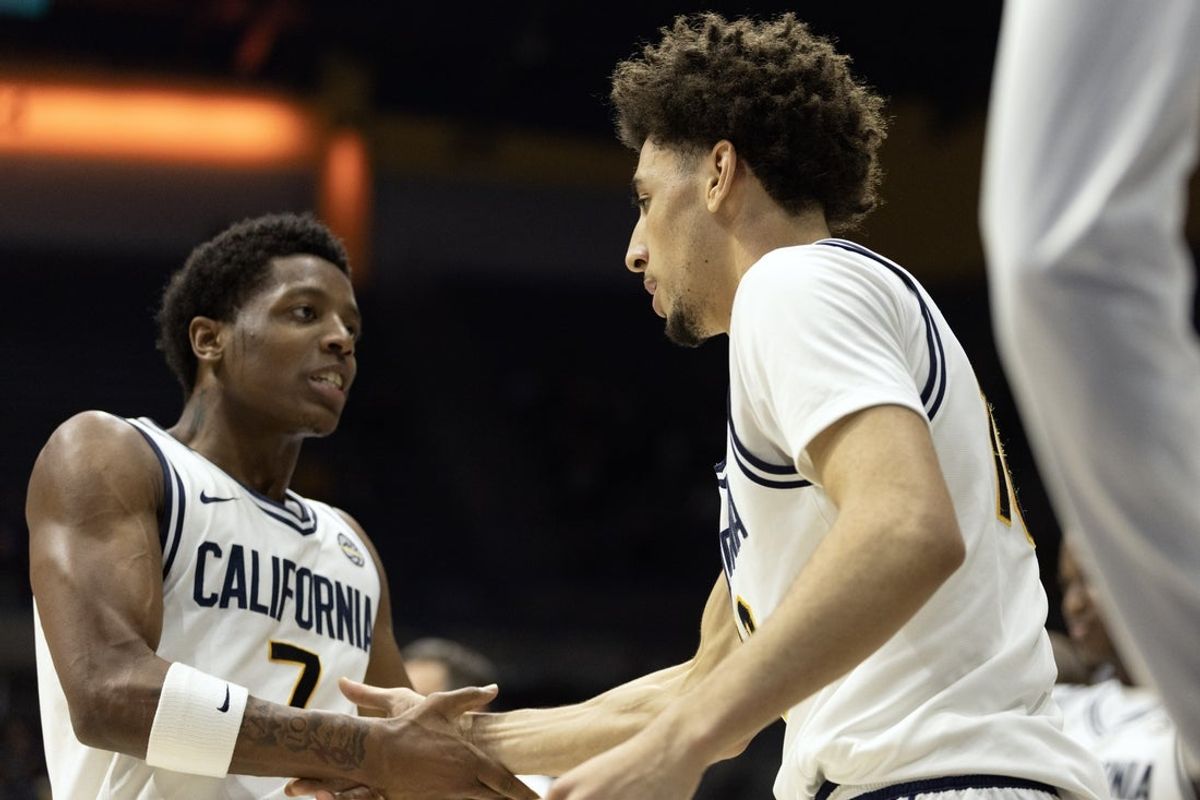 Feb 4, 2026; Berkeley, California, USA; California Golden Bears guard Dai Dai Ames (7) congratulates Justin Pippen on his foul and basket against the Georgia Tech Yellow Jackets during the second half at Haas Pavilion. Mandatory Credit: D. Ross Cameron-Imagn Images