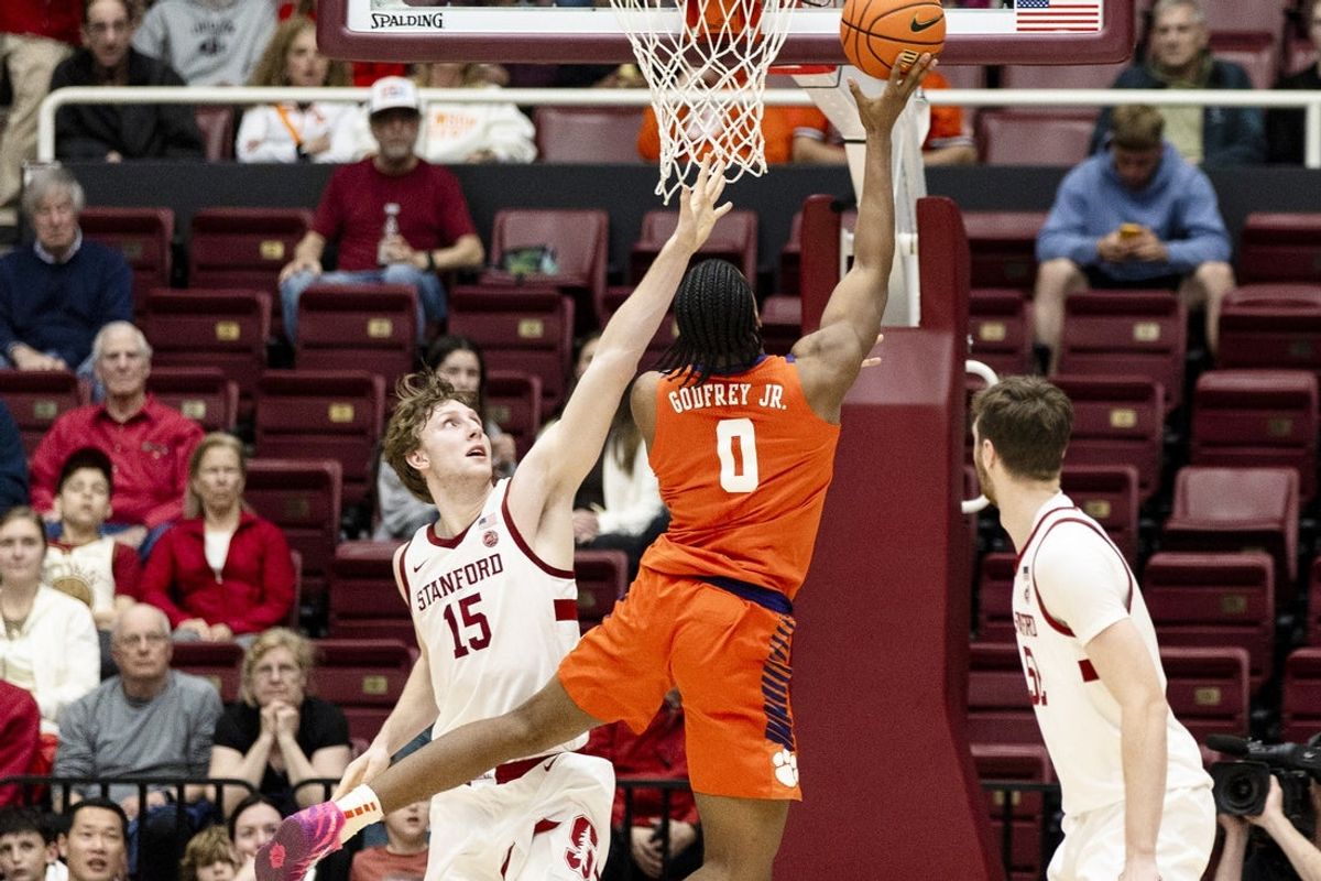 Feb 4, 2026; Stanford, California, USA;  Clemson Tigers forward RJ Godfrey (0) shoots as Stanford Cardinal forward Oskar Giltay (15) defends during the first half at Maples Pavilion. Mandatory Credit: John Hefti-Imagn Images