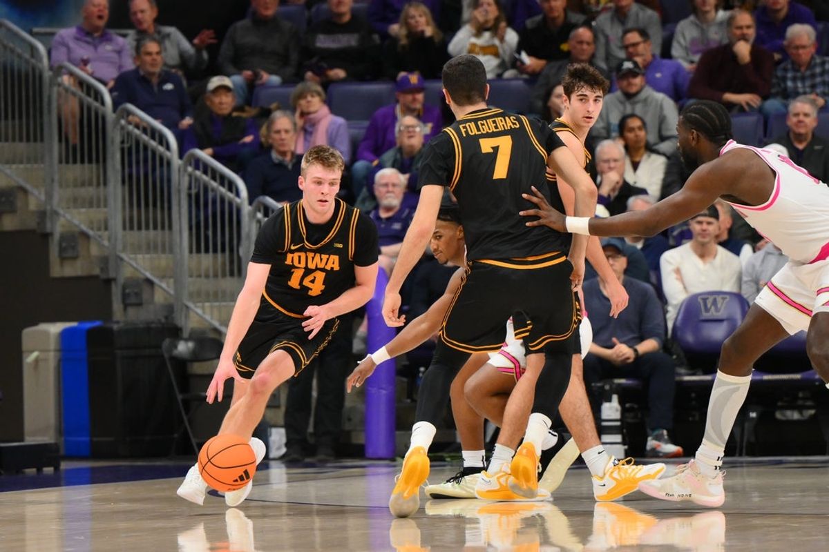 Feb 4, 2026; Seattle, Washington, USA; Iowa Hawkeyes guard Bennett Stirtz (14) dribbles the ball during the first half against the Washington Huskies at Alaska Airlines Arena at Hec Edmundson Pavilion. Mandatory Credit: Steven Bisig-Imagn Images