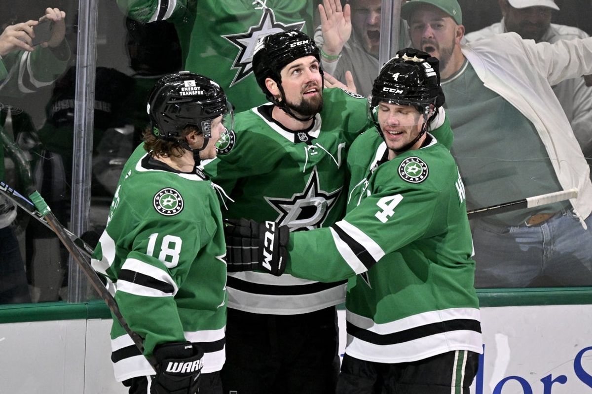 Feb 4, 2026; Dallas, Texas, USA; Dallas Stars left wing Jamie Benn (14) and center Sam Steel (18) and defenseman Miro Heiskanen (4) celebrate after Benn scores the game winning goal against the St. Louis Blues during the third period at the American Airlines Center. Mandatory Credit: Jerome Miron-Imagn Images