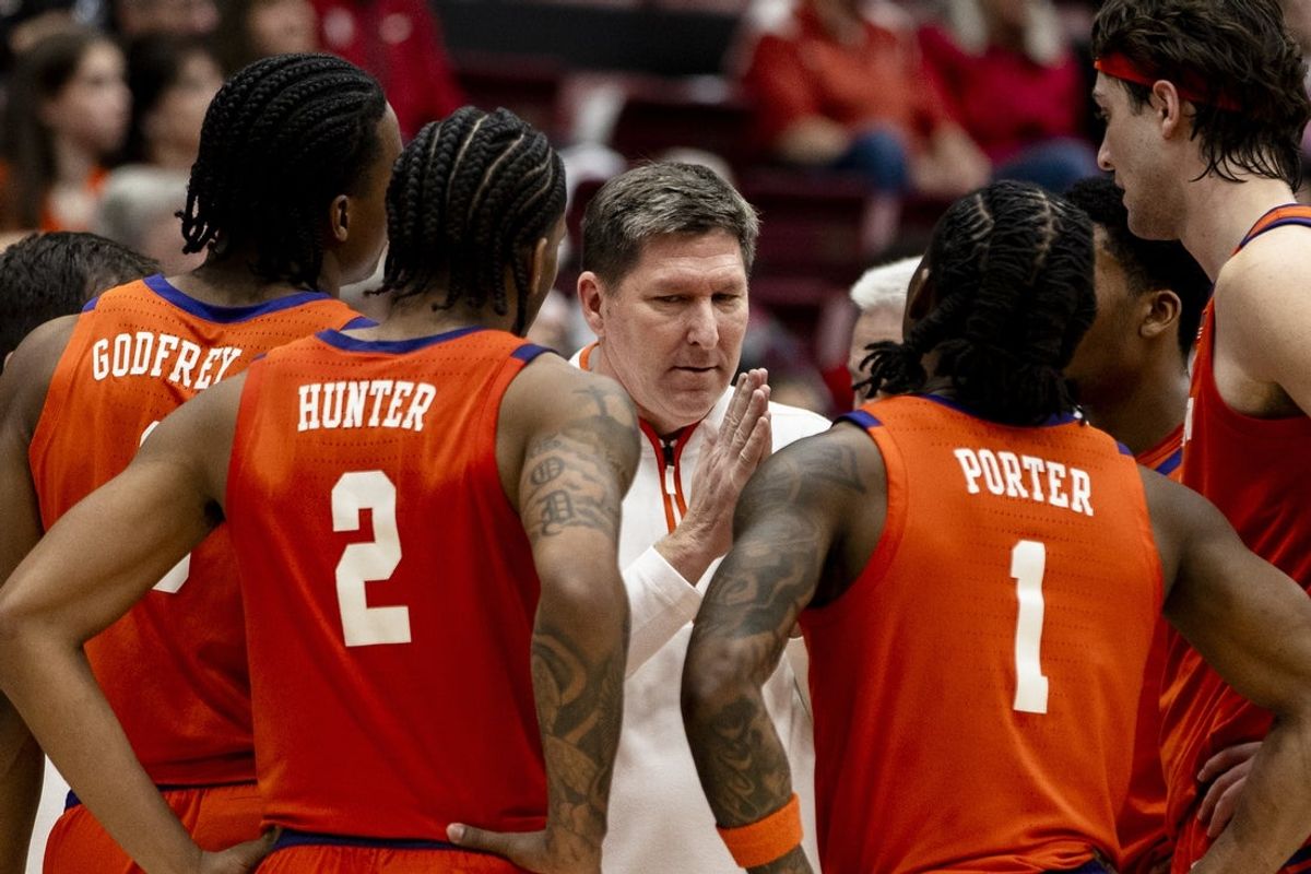 Feb 4, 2026; Stanford, California, USA;  Clemson Tigers head coach Brad Brownell talks with guard Jestin Porter (1), guard Dillon Hunter (2) and other players during a time-out in the second half against the Stanford Cardinal at Maples Pavilion. Mandatory Credit: John Hefti-Imagn Images