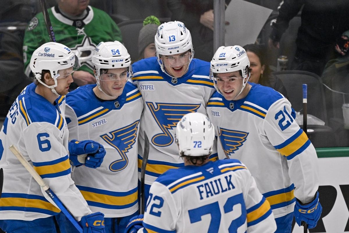 Feb 4, 2026; Dallas, Texas, USA; St. Louis Blues right wing Dalibor Dvorsky (54) and right wing Alexey Toropchenko (13) and defenseman Philip Broberg (6) and defenseman Justin Faulk (72) and right wing Jimmy Snuggerud (21) celebrates a goal scored by Toropchenko against the Dallas Stars during the third period at the American Airlines Center. Mandatory Credit: Jerome Miron-Imagn Images