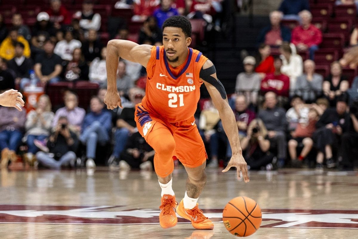 Feb 4, 2026; Stanford, California, USA;  Clemson Tigers guard Ace Buckner (21) dribbles against the Stanford Cardinal during the second half at Maples Pavilion. Mandatory Credit: John Hefti-Imagn Images