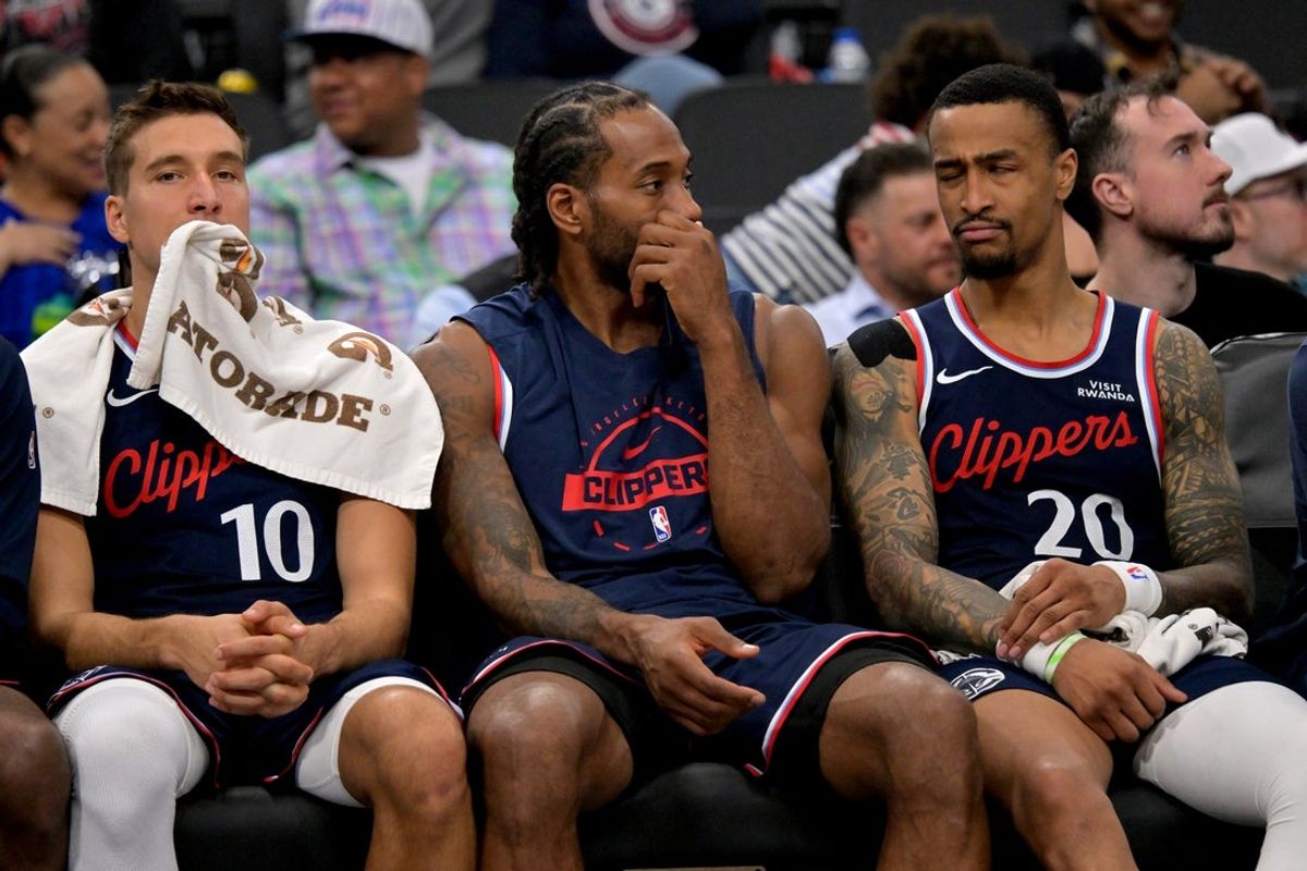 Feb 4, 2026; Inglewood, California, USA; Los Angeles Clippers guard Bogdan Bogdanovic (10), Los Angeles Clippers forward Kawhi Leonard (2) and Los Angeles Clippers forward John Collins (20) sit on the bench in the fourth quarter the Cleveland Cavaliers at Intuit Dome. Mandatory Credit: Jayne Kamin-Oncea-Imagn Images