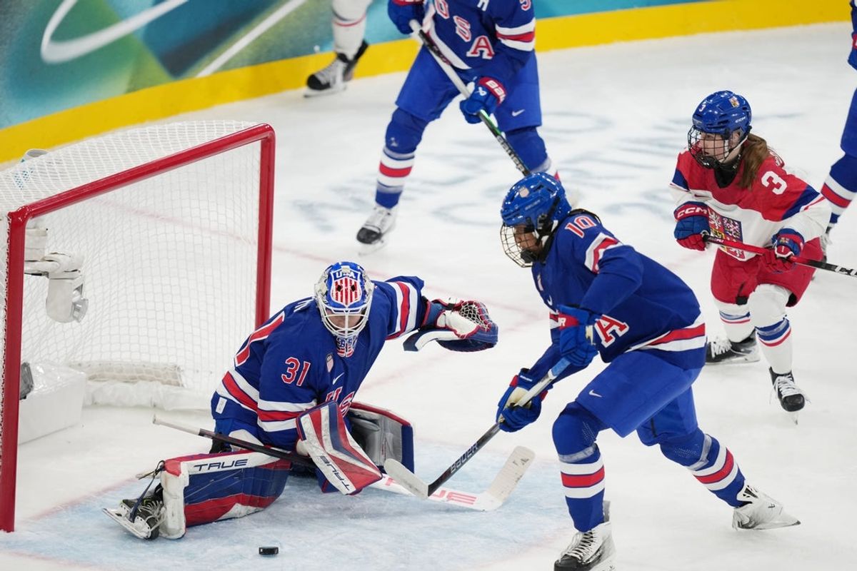 Feb 5, 2026; Milan, Italy; Aerin Frankel (31) of Team United States makes a save against Team Czechia  in women's ice hockey Group A play during the Milano Cortina 2026 Olympic Winter Games at Milano Rho Ice Hockey Arena. Mandatory Credit: James Lang-Imagn Images