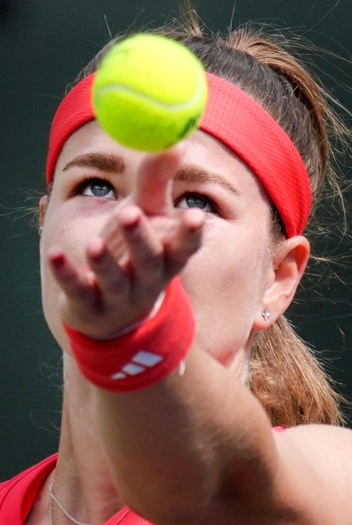 Karolina Muchova serves to Iga Swiatek on Stadium 1 during their round of 16 match at the BNP Paribas Open in Indian Wells, Calif., on Tuesday, March 11, 2025.